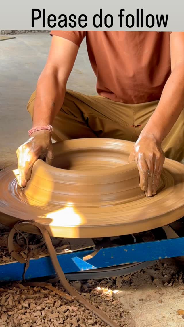 A potter shaping a traditional Chandani Chowki on the wheel.